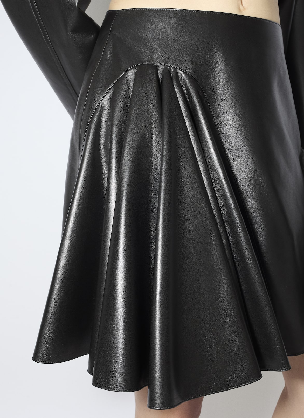 LEATHER ASYMMETRICAL SKIRT ALAÏA BLACK LEATHER ASYMMETRICAL SKIRT